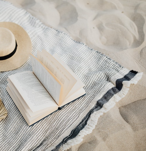 beach-blue-about-april book on beach towel